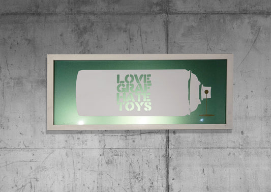 Art Jaz - 'Love Graf Hate Toys' White and Chameleon Wall Art